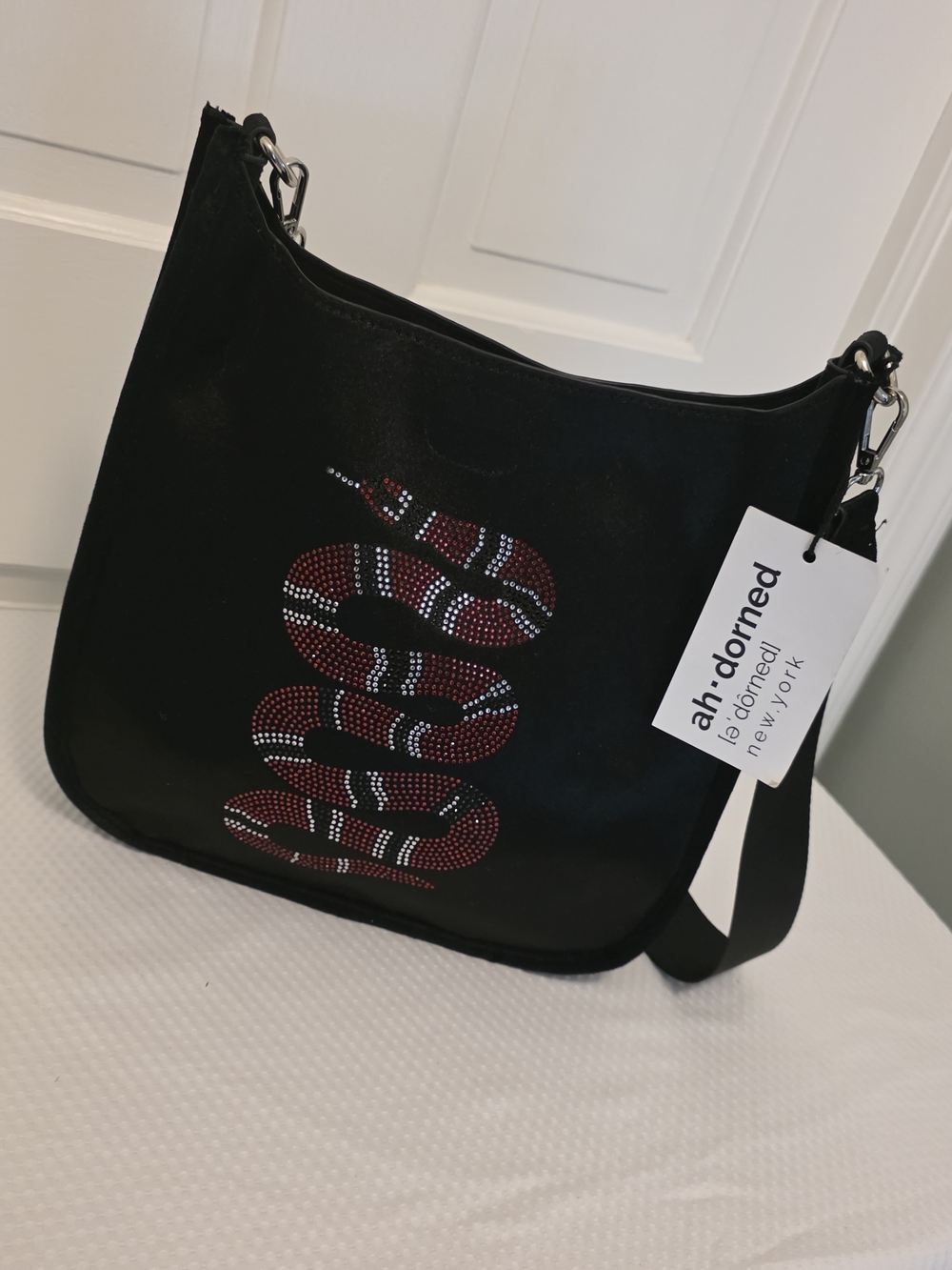 ah-dorned Black Crossbody Bag with Red Snake Crystal Motif